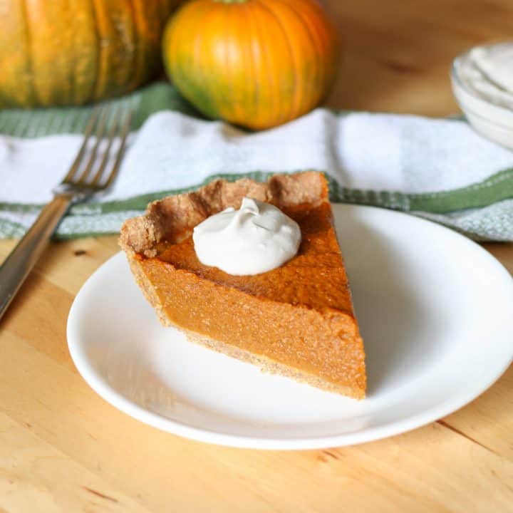slice of pumpkin pie on plate and fork