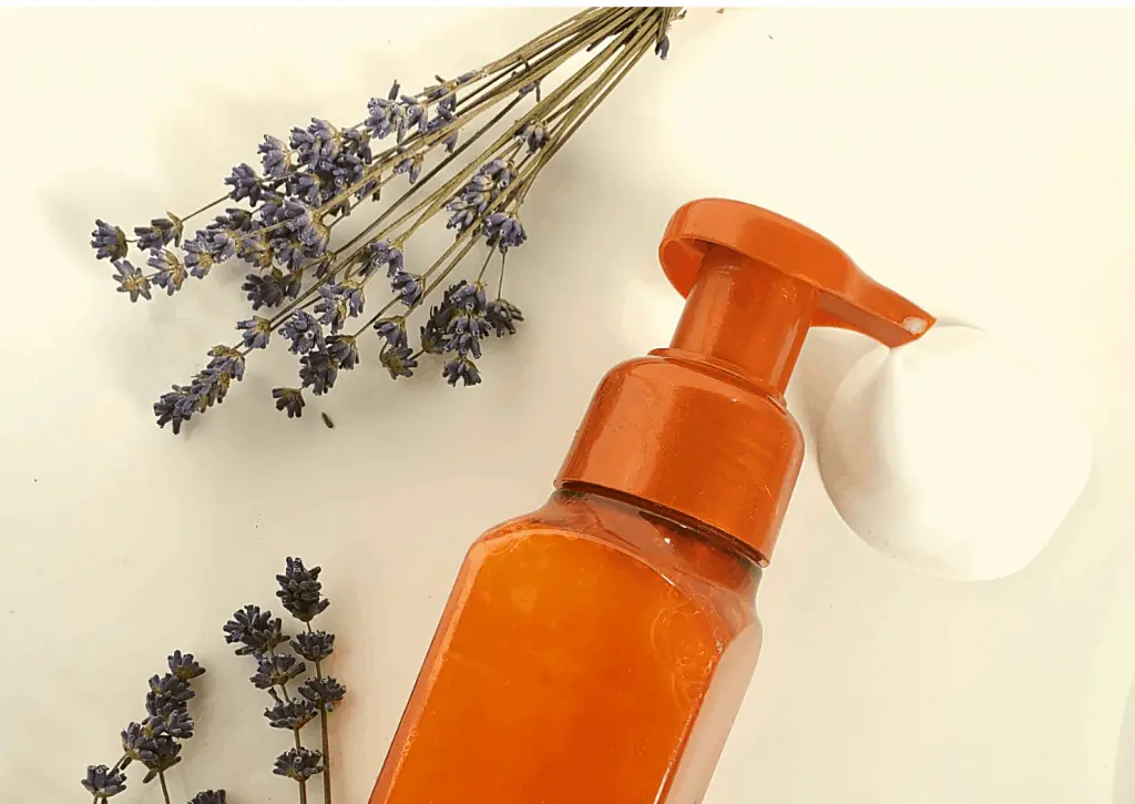 Soap dispenser and lavender on counter