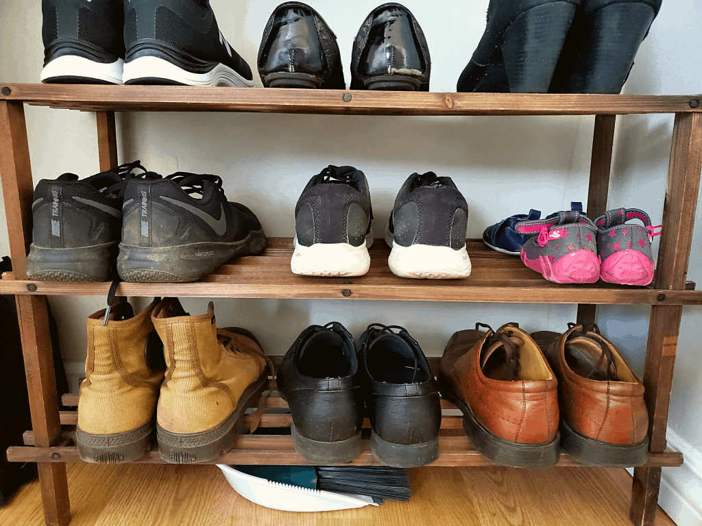 Shoe rack organization in entryway closet