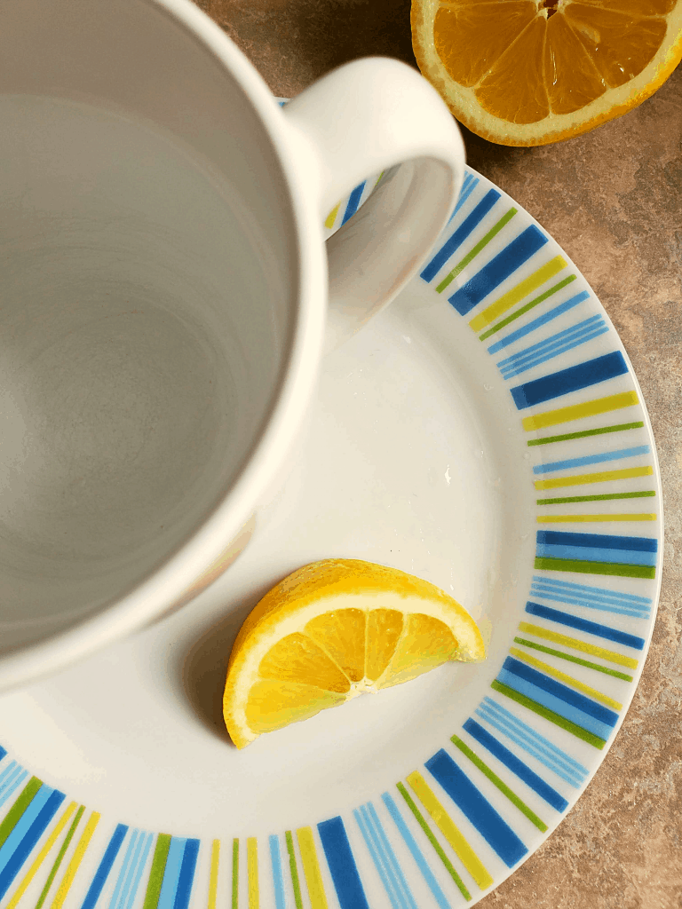 Cup of water with slice of lemon
