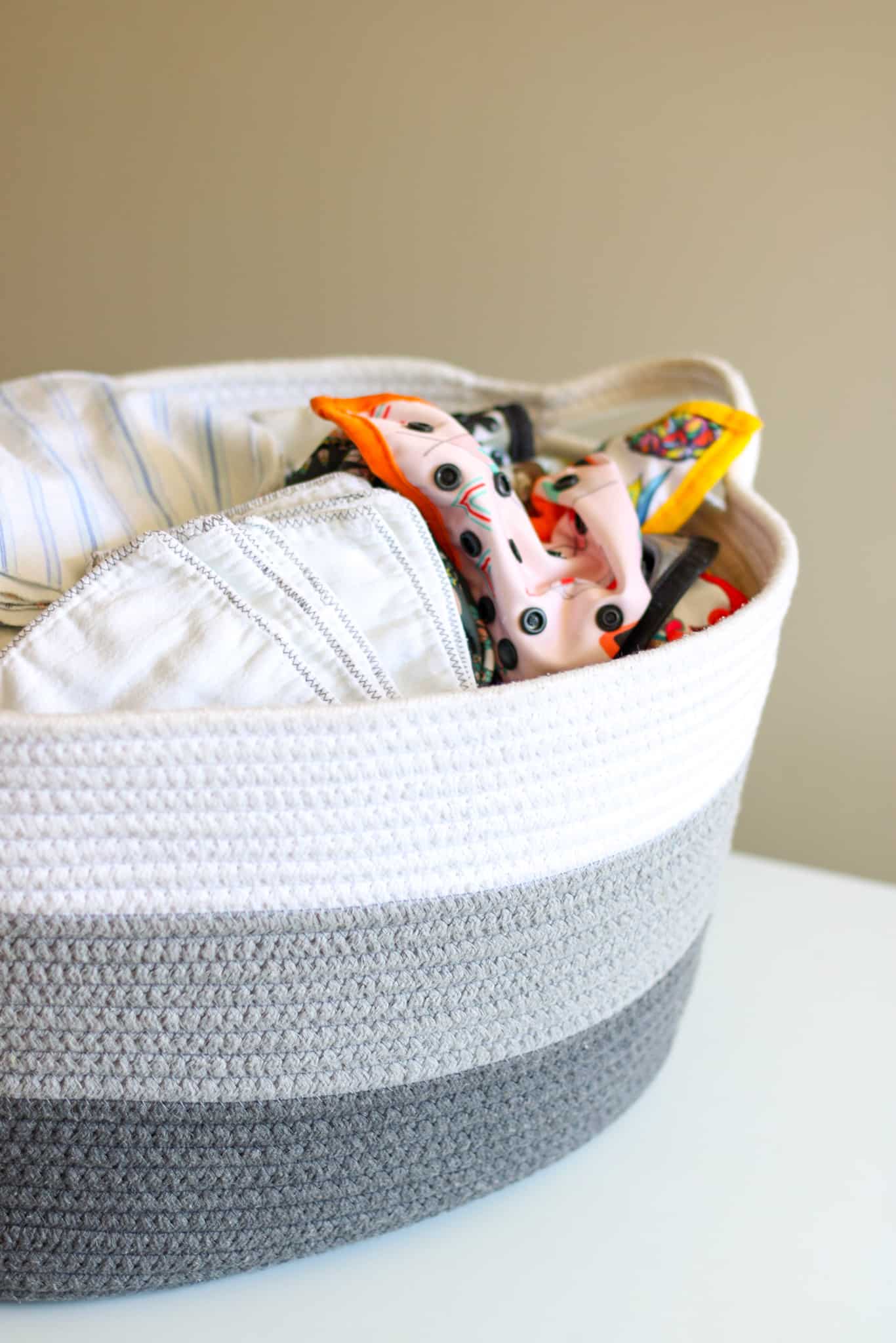 basket filled with cloth diaper supplies