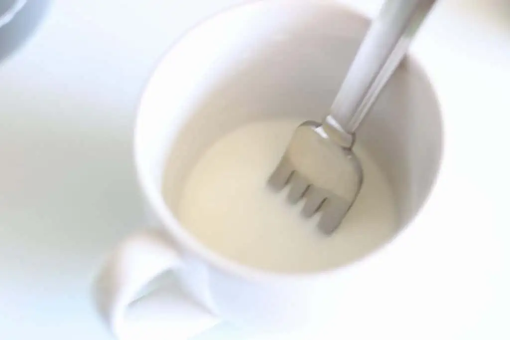 cornstarch slurry with fork in a mug