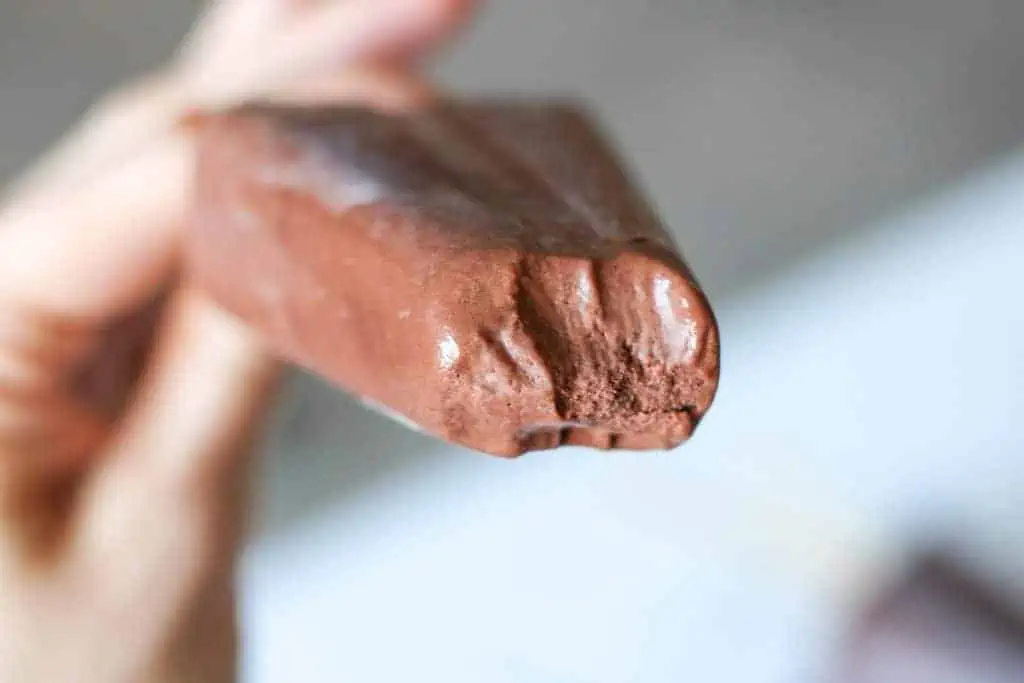chocolate popsicle with bite taken out of it