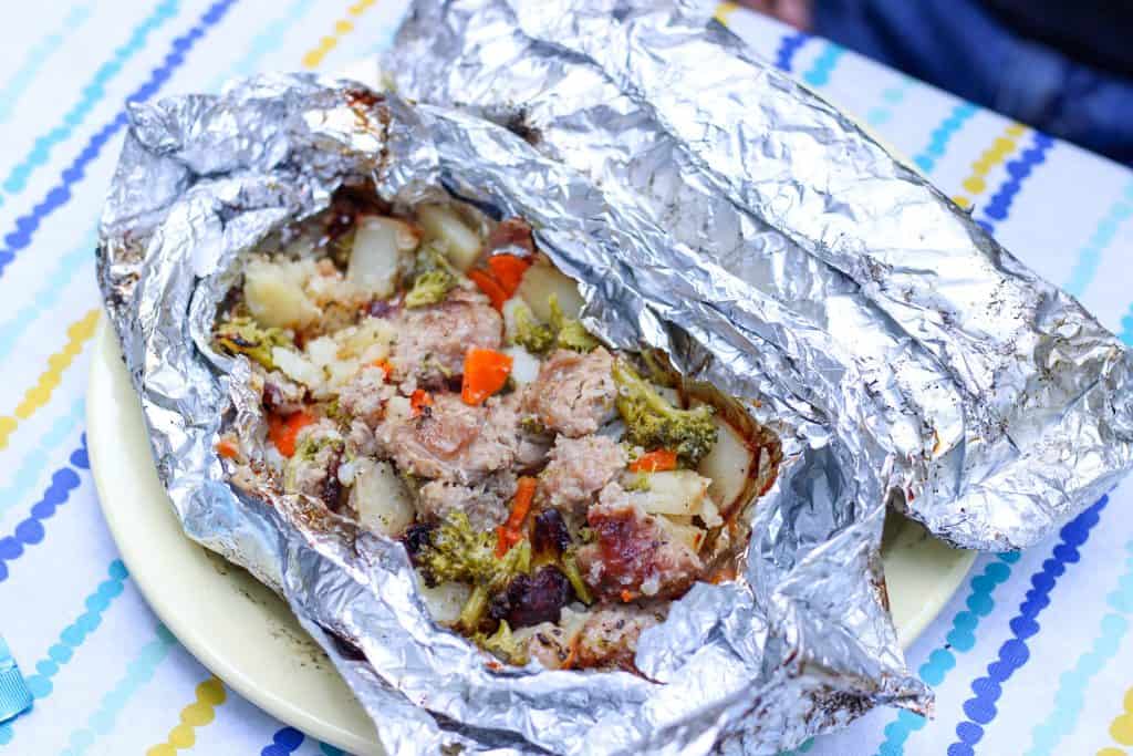 sausage and veggie foil packet dinner on plate