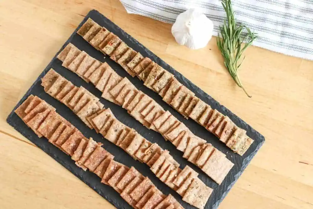 sprouted wheat crackers laid out on a board