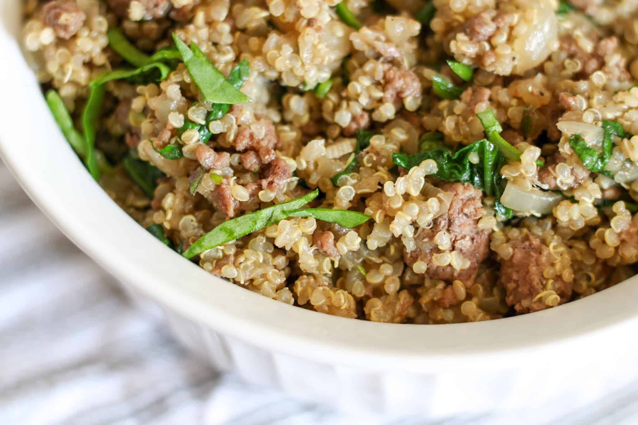 closeup of beef, quinoa, spinach dish
