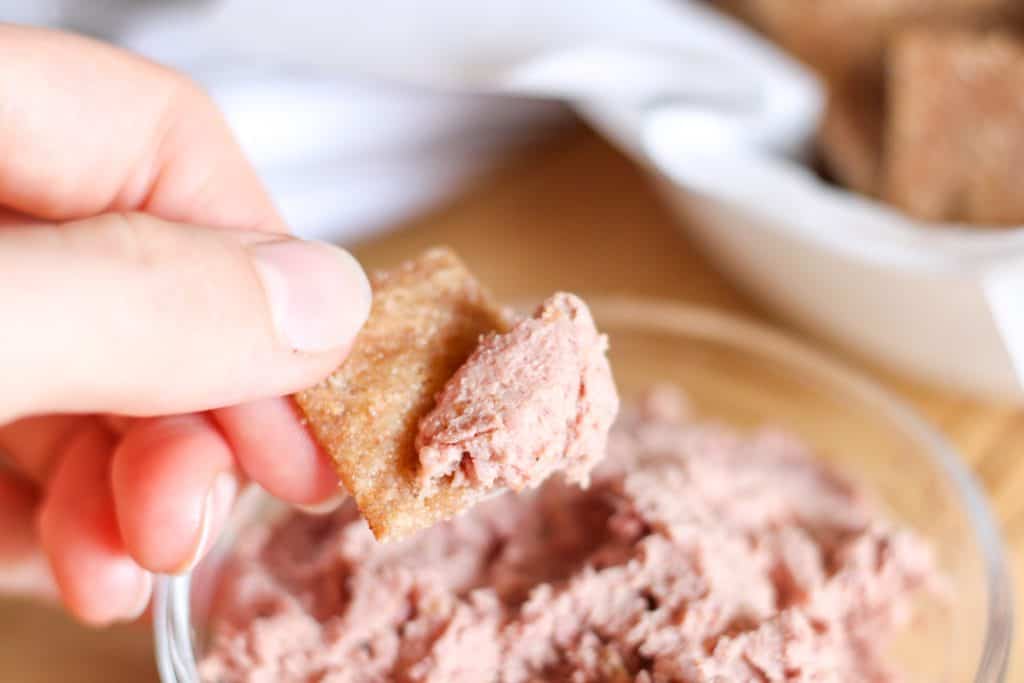 dipping cracker in pate
