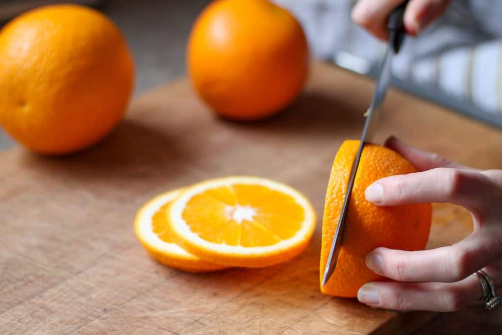 cutting orange slices