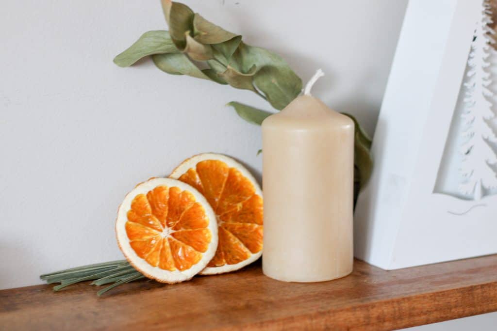 beeswax candle and orange slices