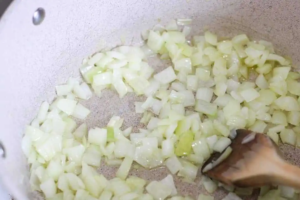 sauteing onions in a pot