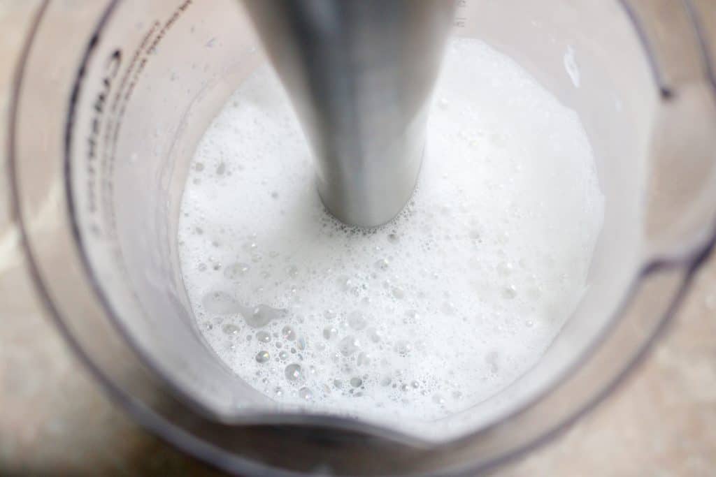 Frothing coconut milk with an immersion blender