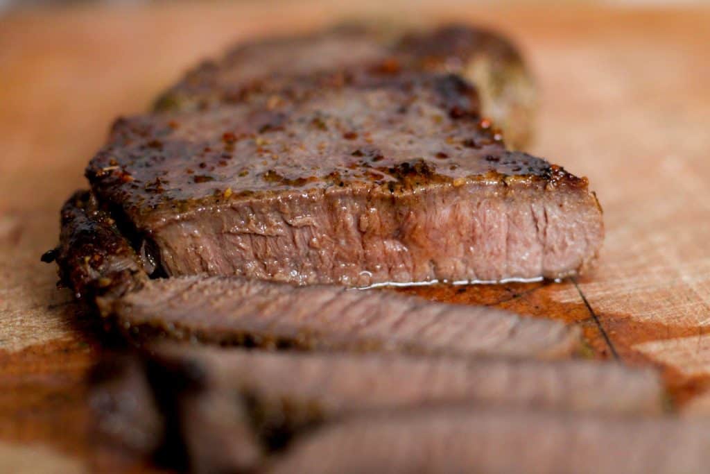 A juicy venison steak cut open