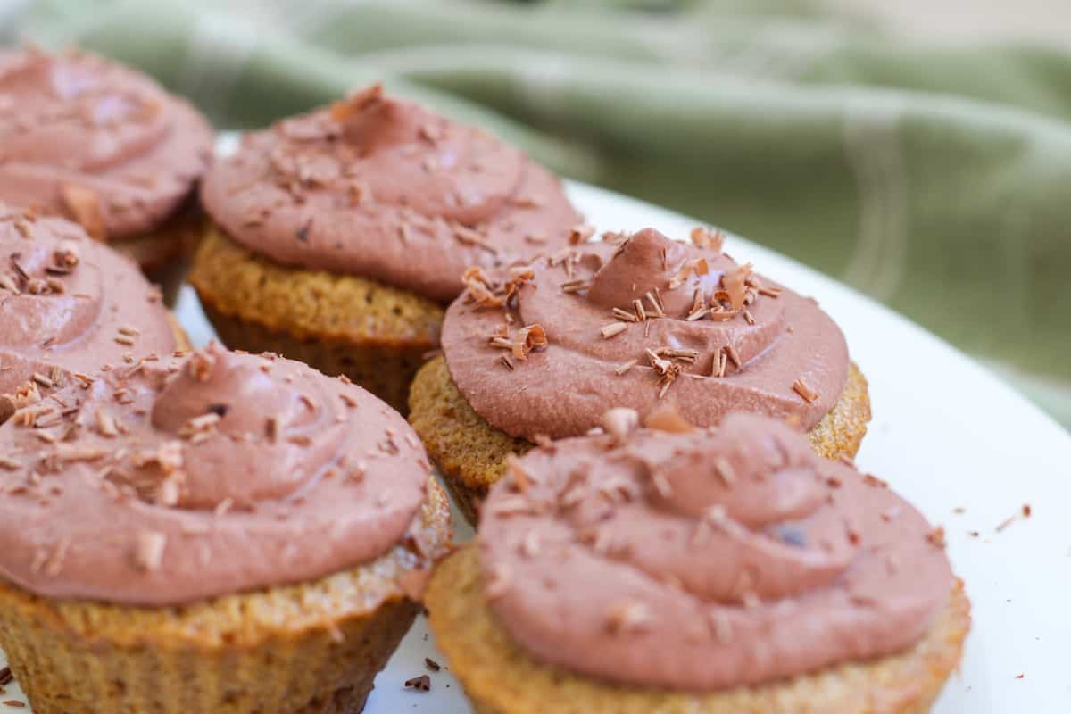 cupcakes with chocolate frosting and shavings