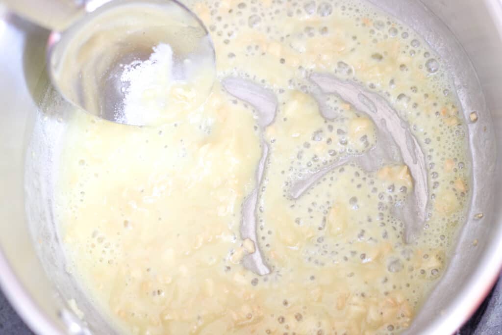 flour with garlic and oil in saucepan