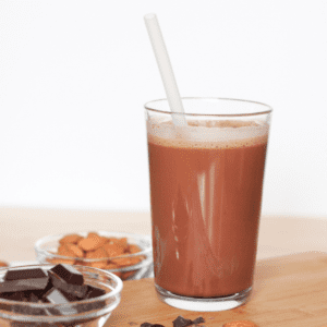 glass of chocolate milk, chocolate and almonds