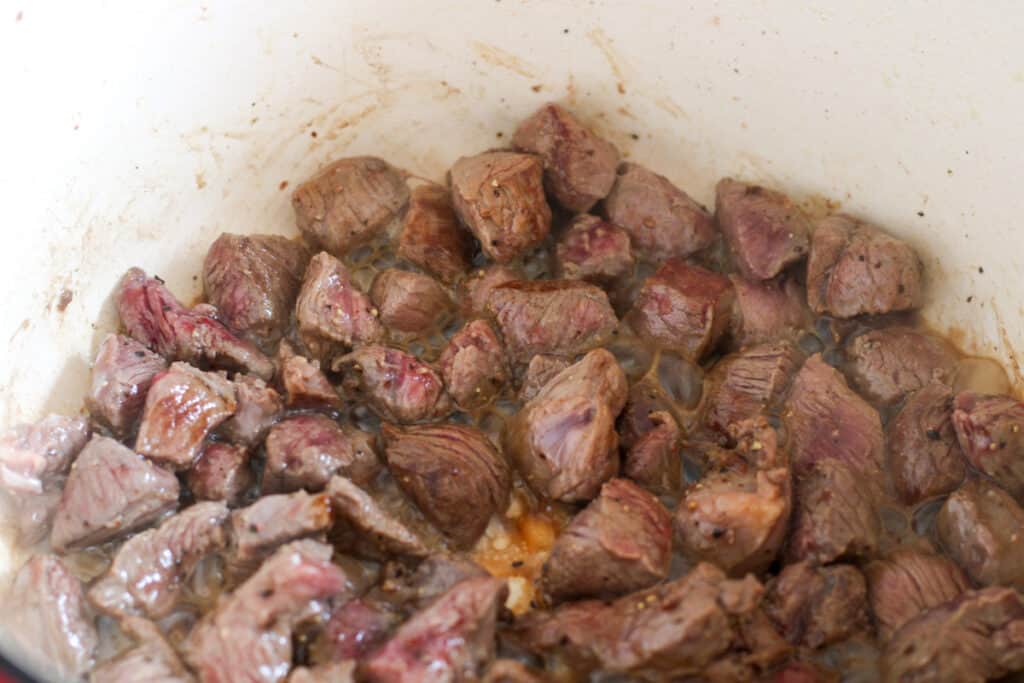 Browned beef chunks on a pot