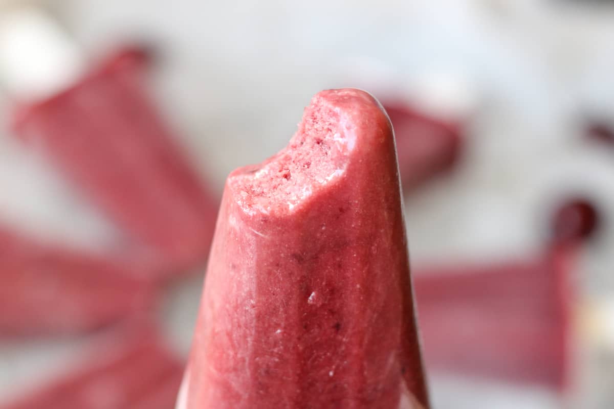 cherry popsicles with a bite taken out of it