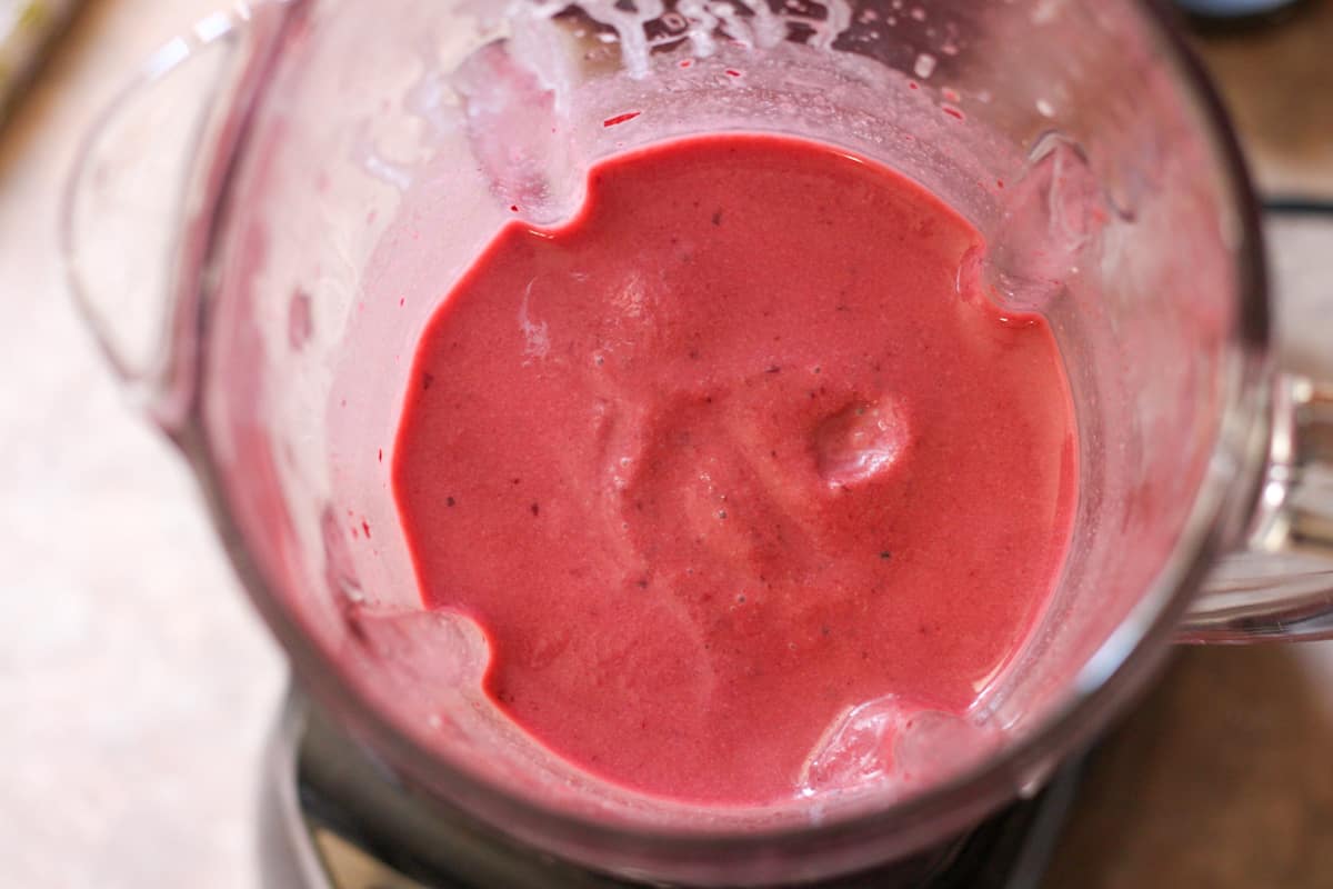 cherry popsicles mixture in a blender