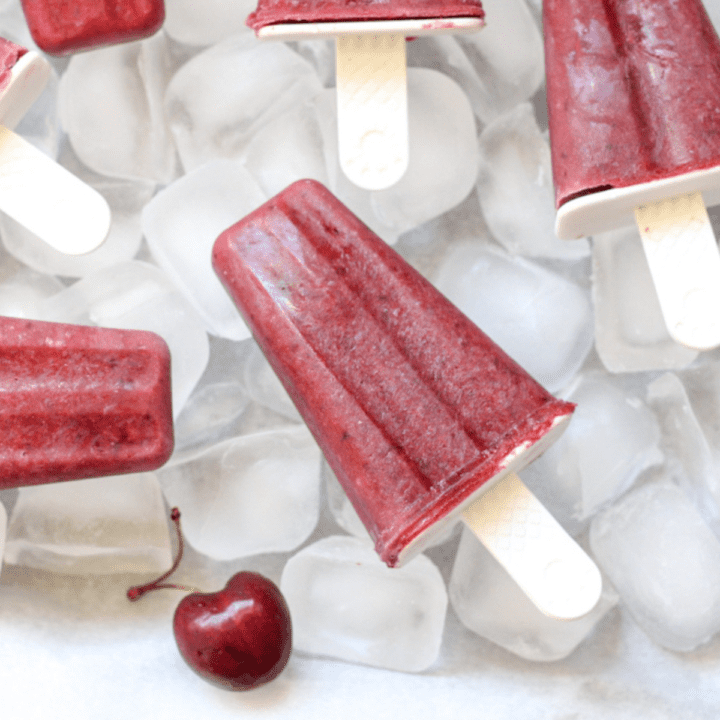 cherry popsicles and cherries on ice cubes