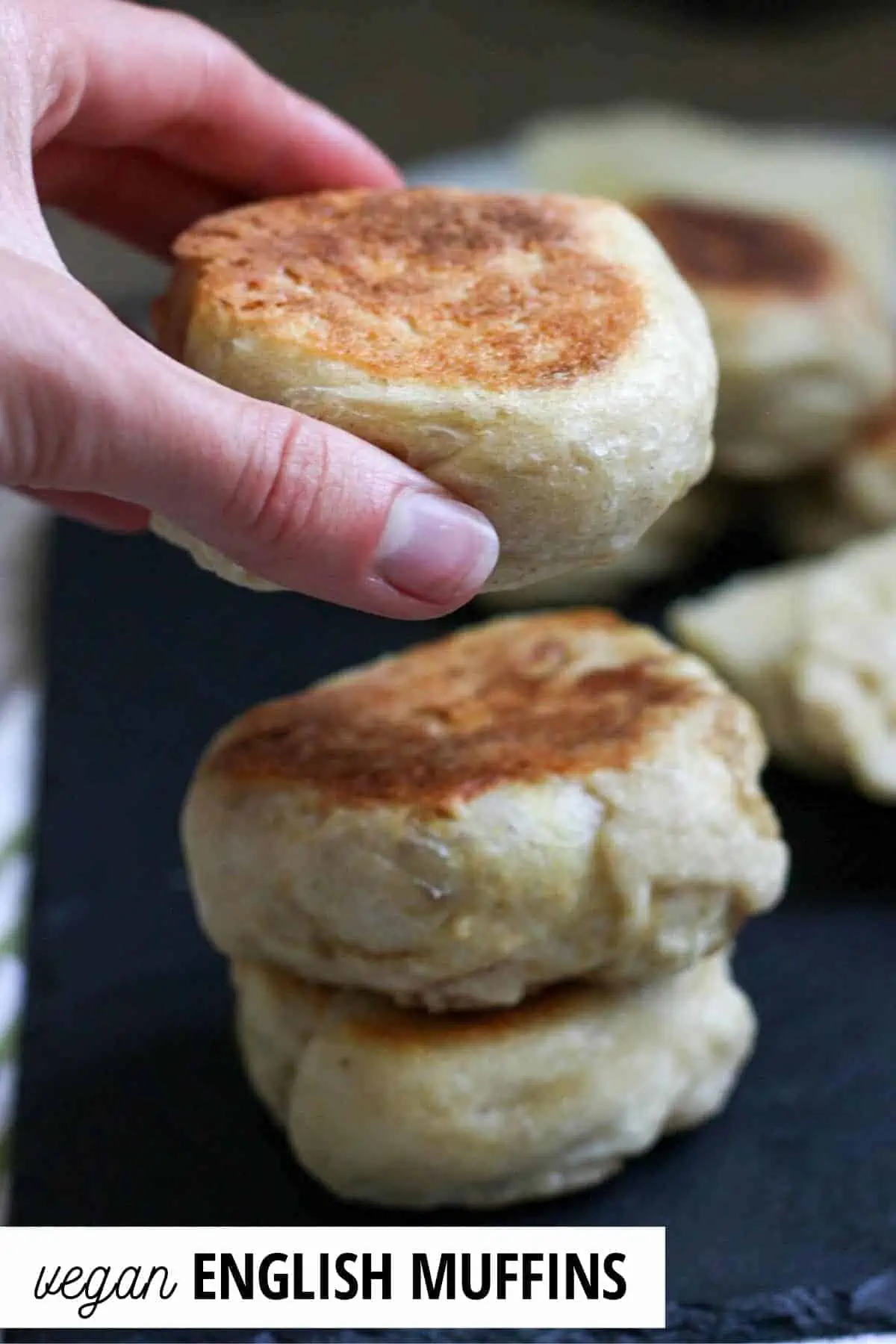 hand picking up an english muffin