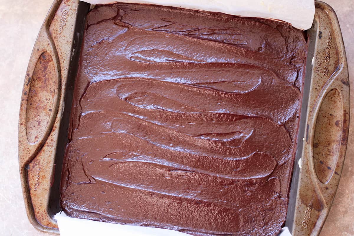 chocolate layer on nanaimo bars in pan