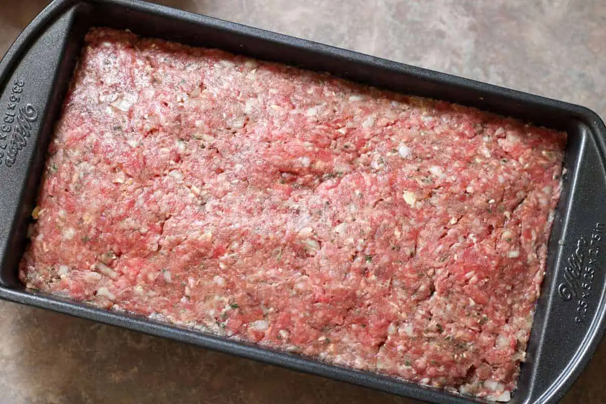 raw meatloaf in pan