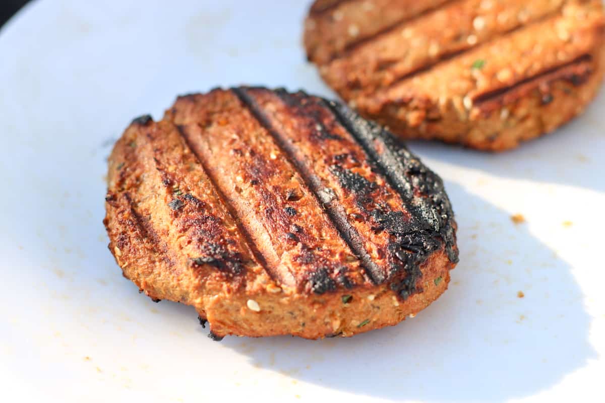 grilled salmon burgers on a plate