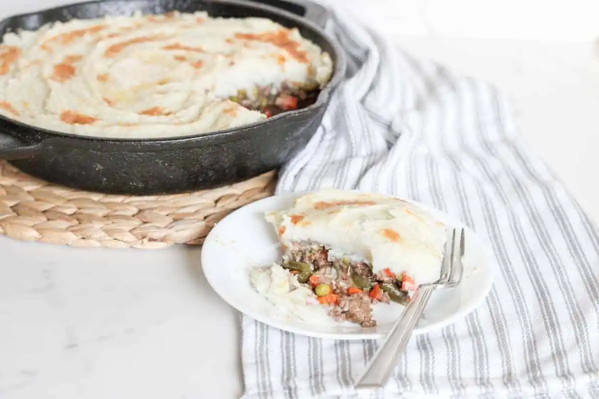 plate and skillet of shepherd's pie