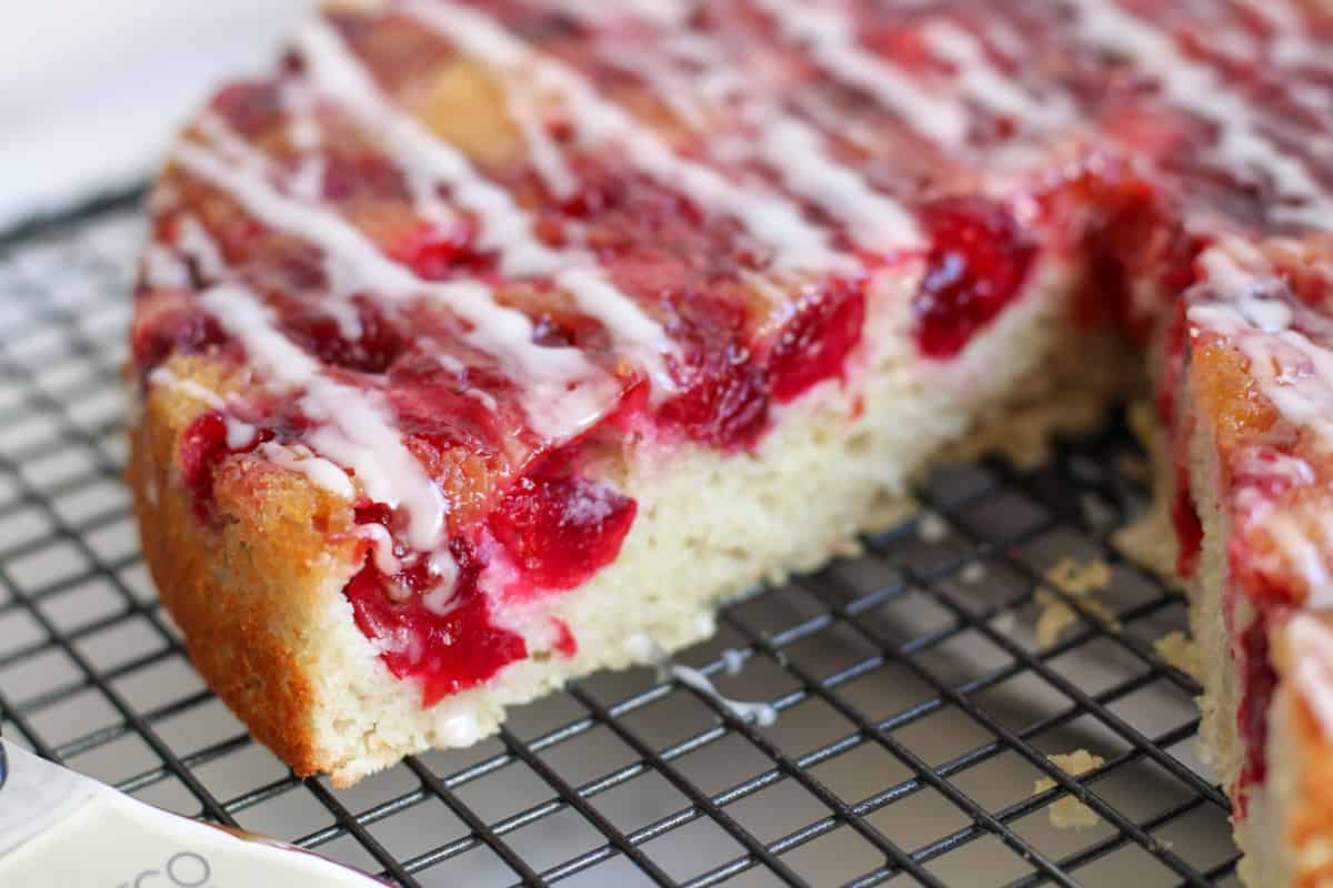 close up of the inside of a cranberry cake on a wire rack