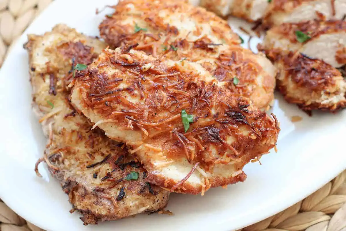 fried chicken breasts on a serving dish