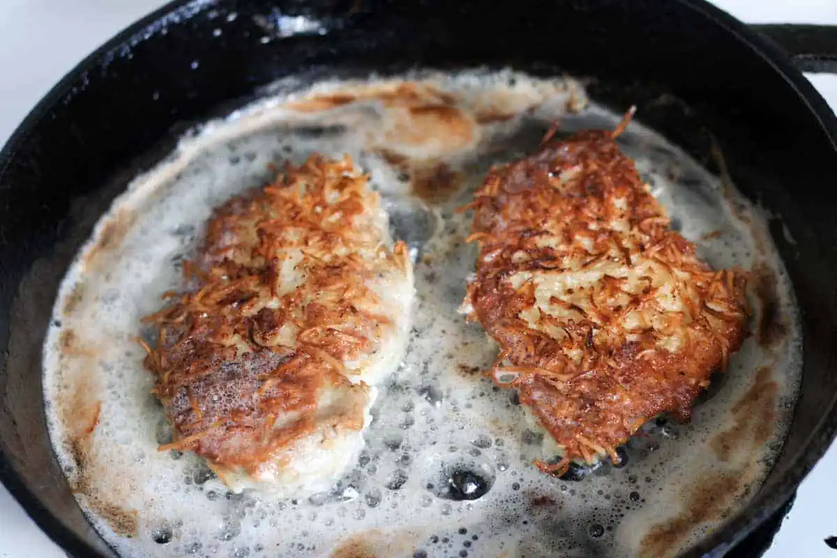 frying chicken in a cast iron skillet