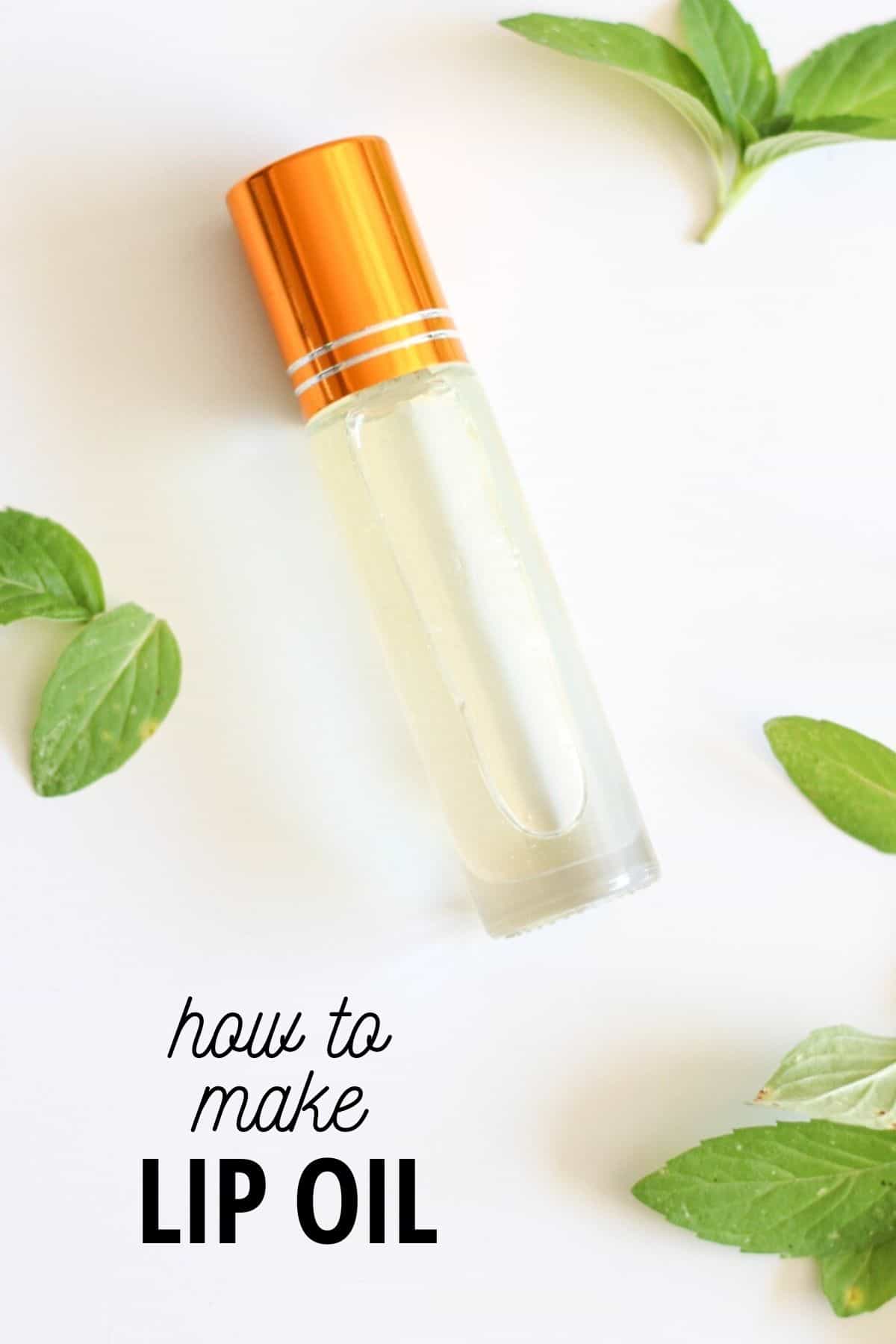roller ball tube of lip oil with mint leaves around it
