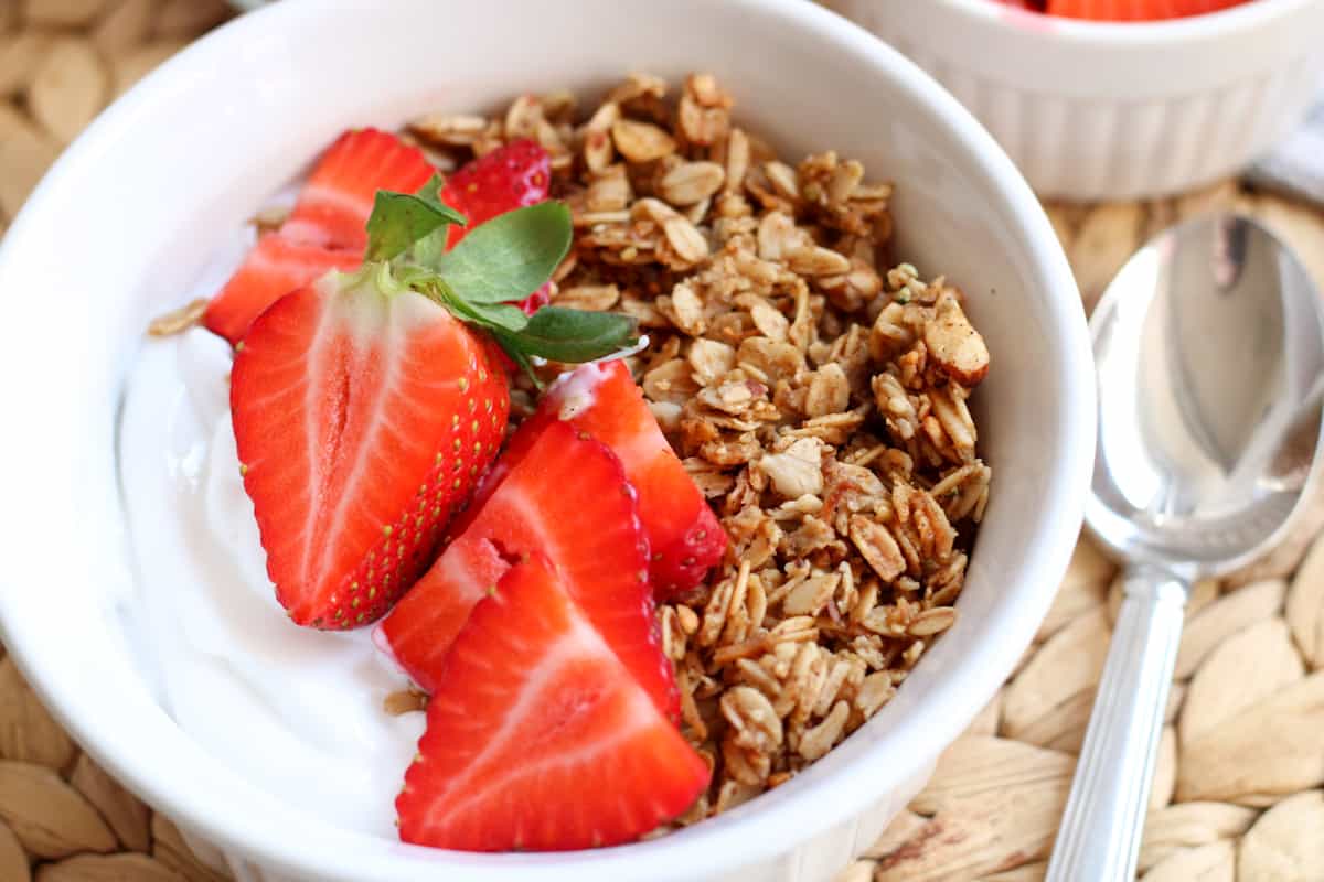 bowl of granola with strawberries and yogurt