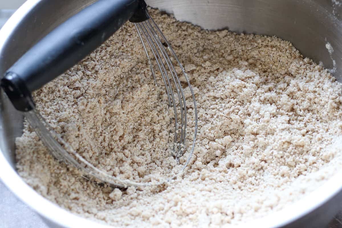 cutting coconut oil into dry ingredients with pastry cutter