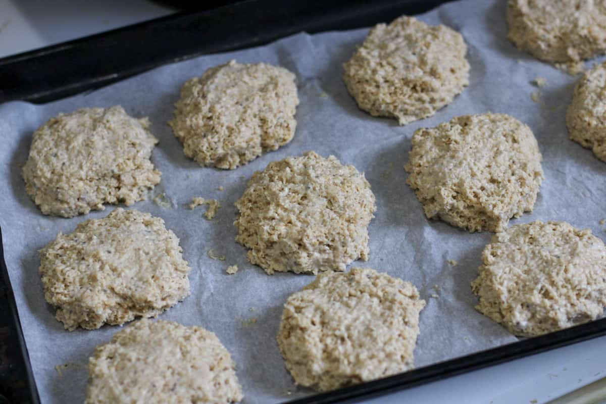 dough formed into biscuits on baking sheet