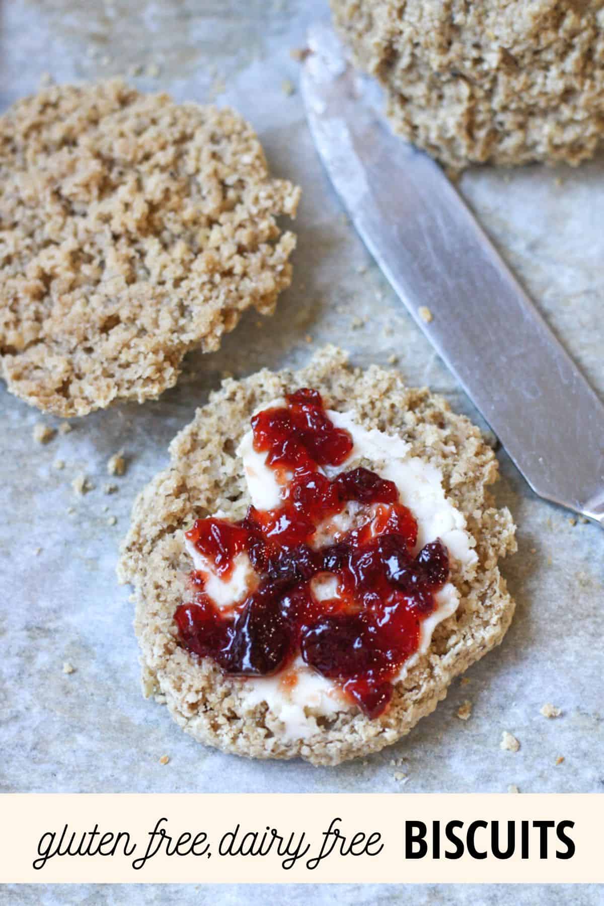 biscuit cut in half with jam and butter