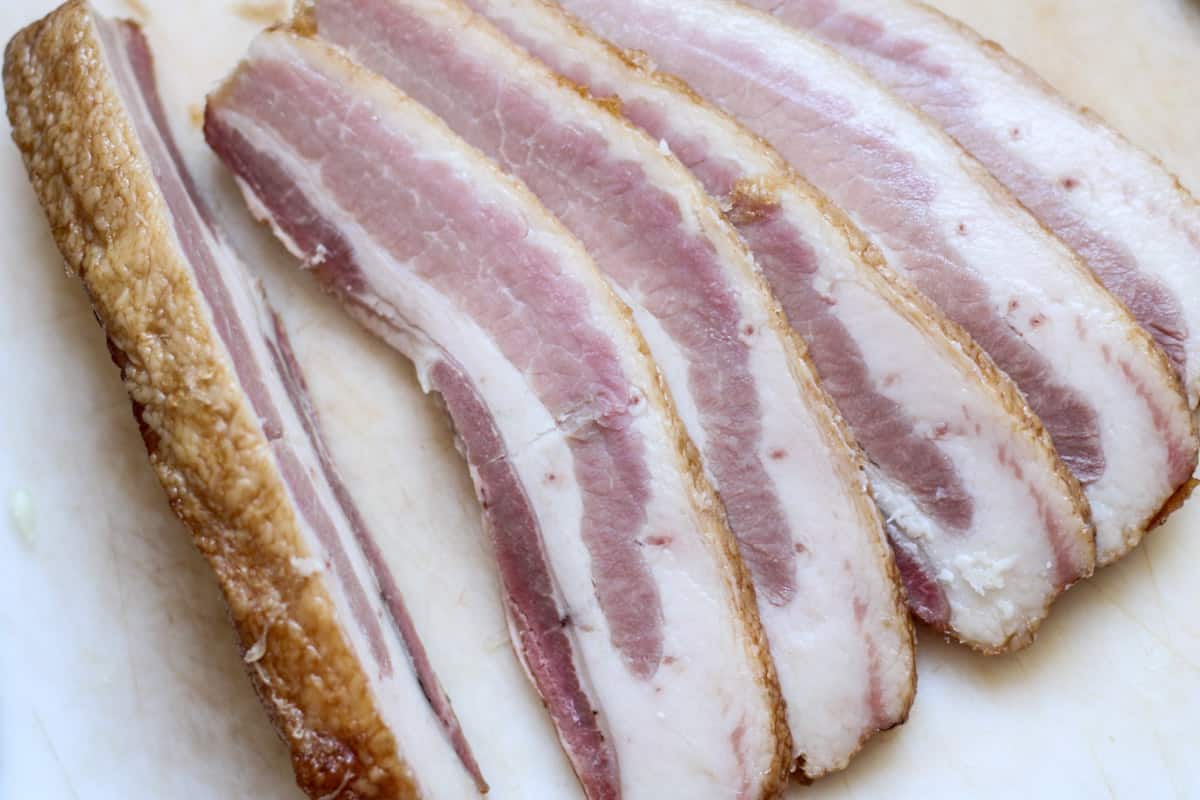 sliced bacon on a cutting board