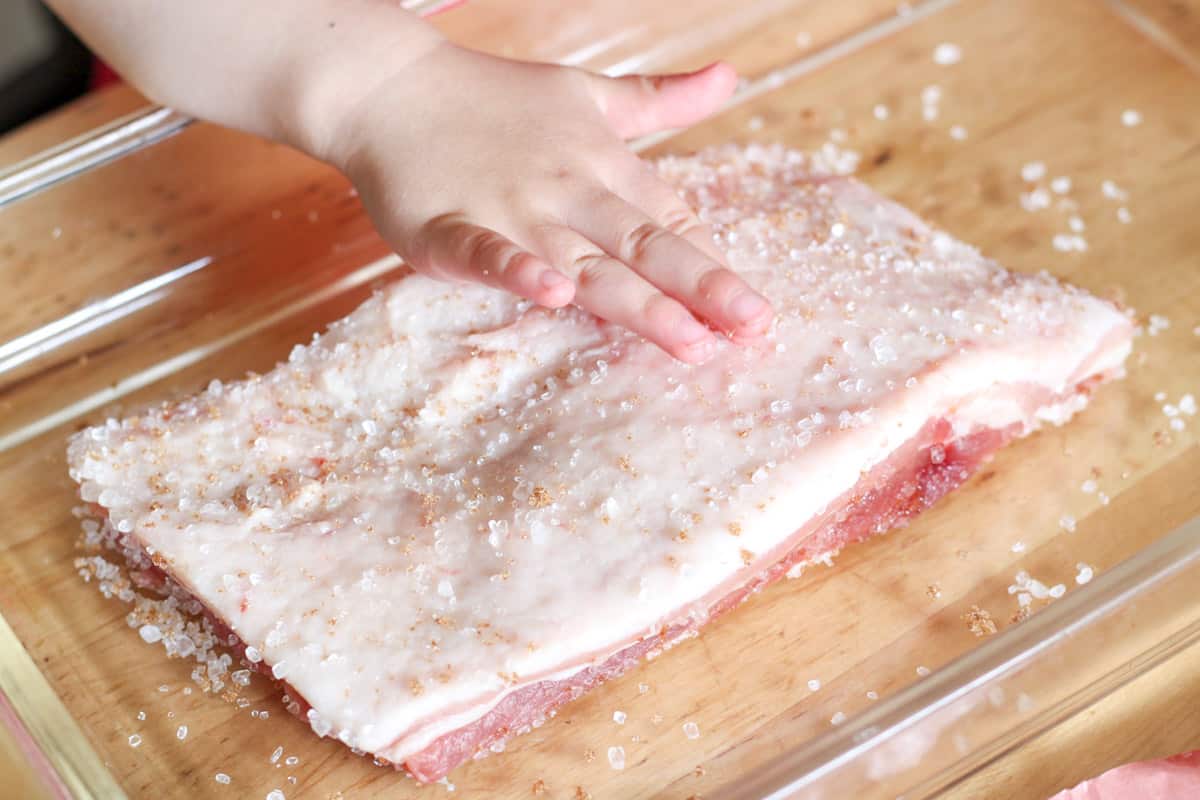rubbing salt/sugar mixture onto pork belly