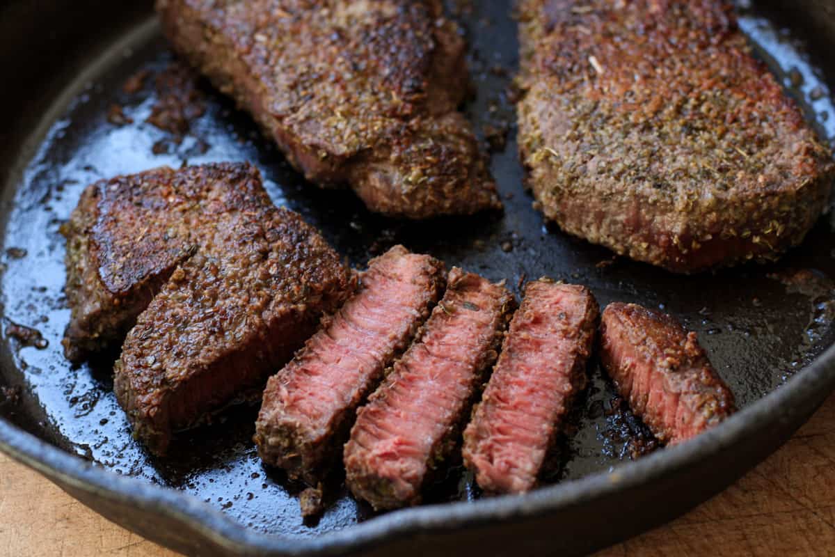 steak in a pan with a few slices