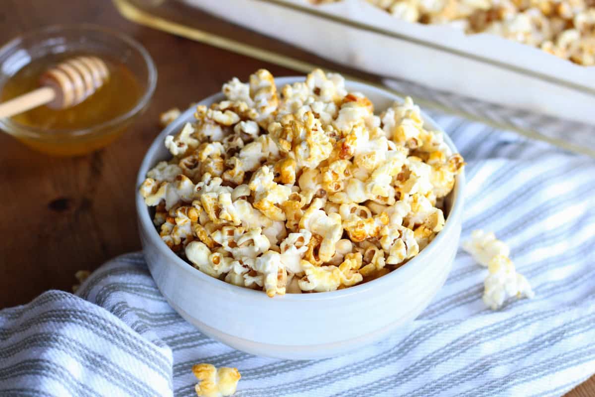 bowl of honey butter popcorn on tea towel