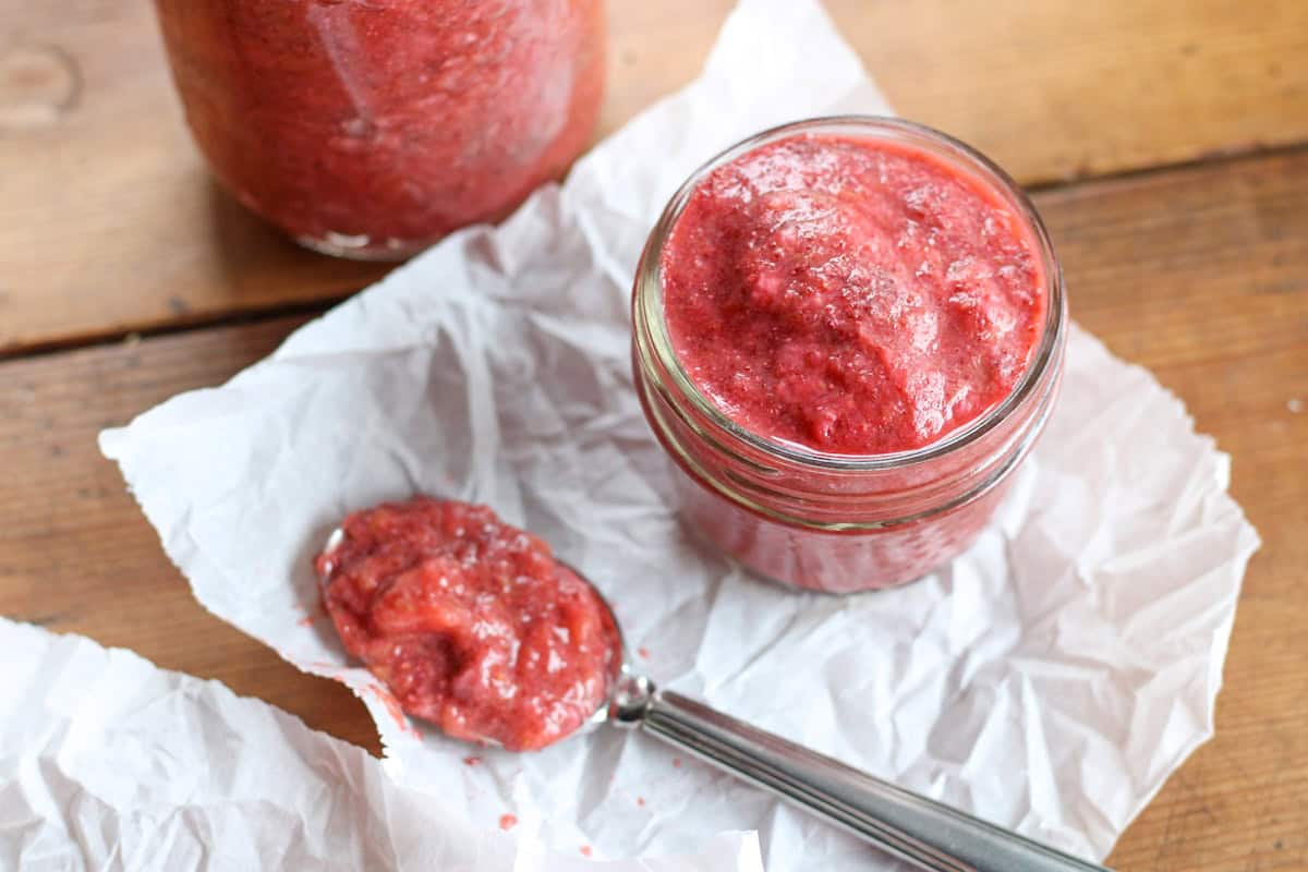 small jar and spoonful of strawberry rhubarb chia jam