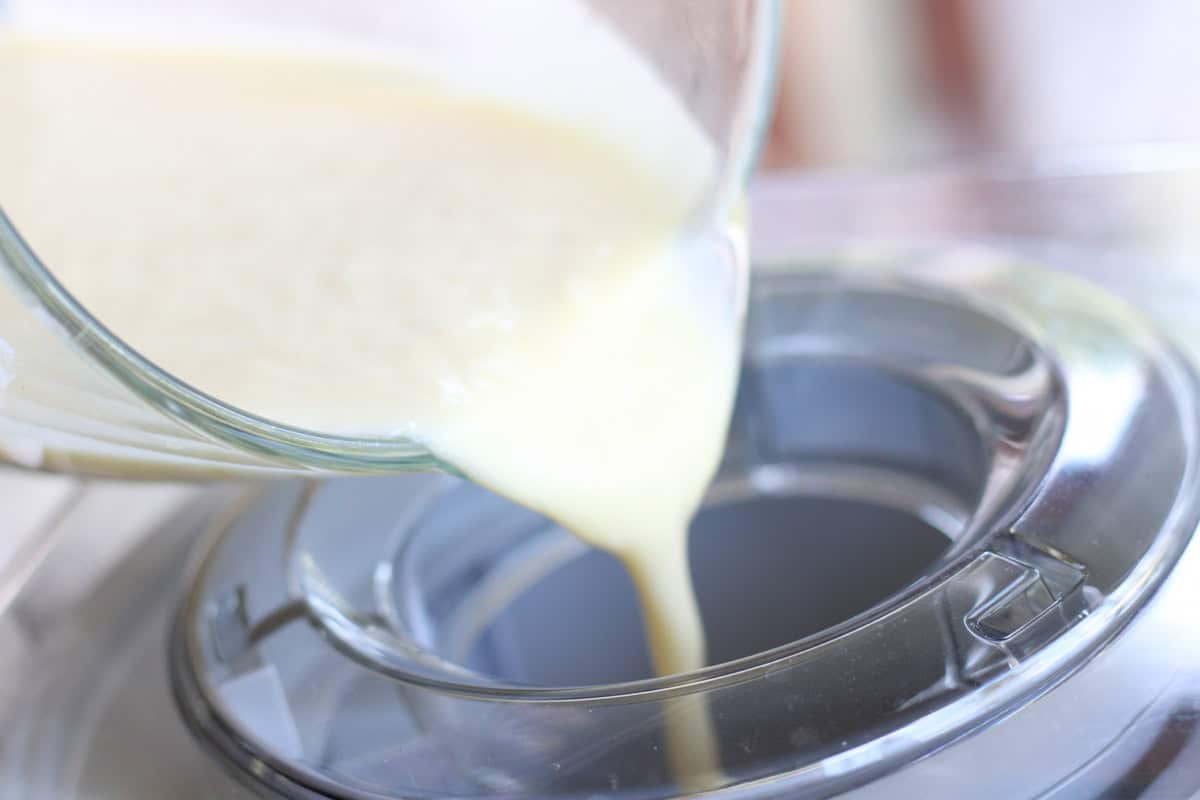 pouring milk mixture into ice cream maker