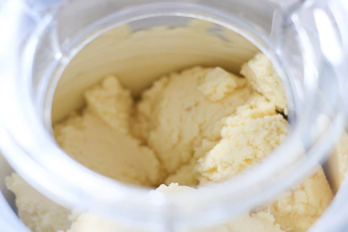 churning pineapple ice cream in ice cream maker