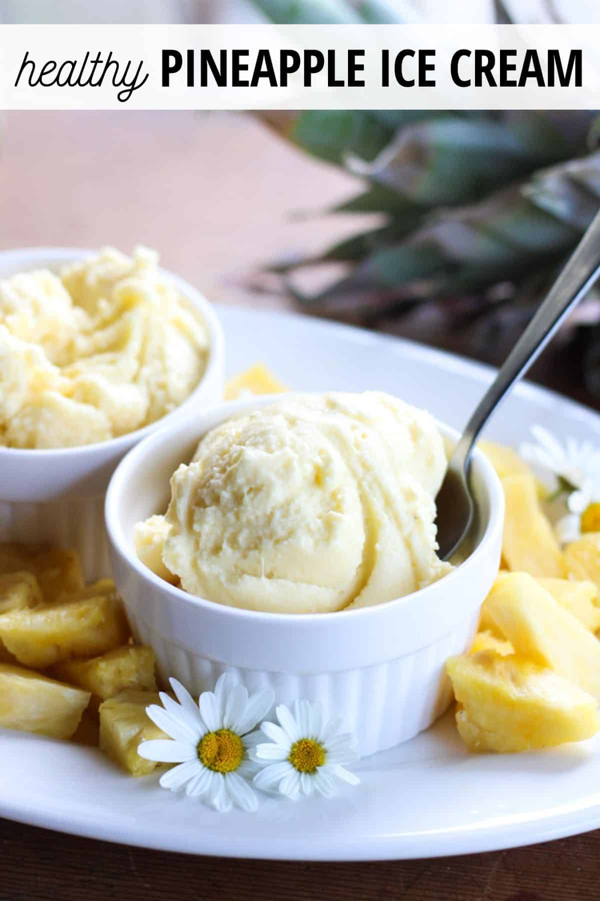pineapple ice cream in serving bowls on tray